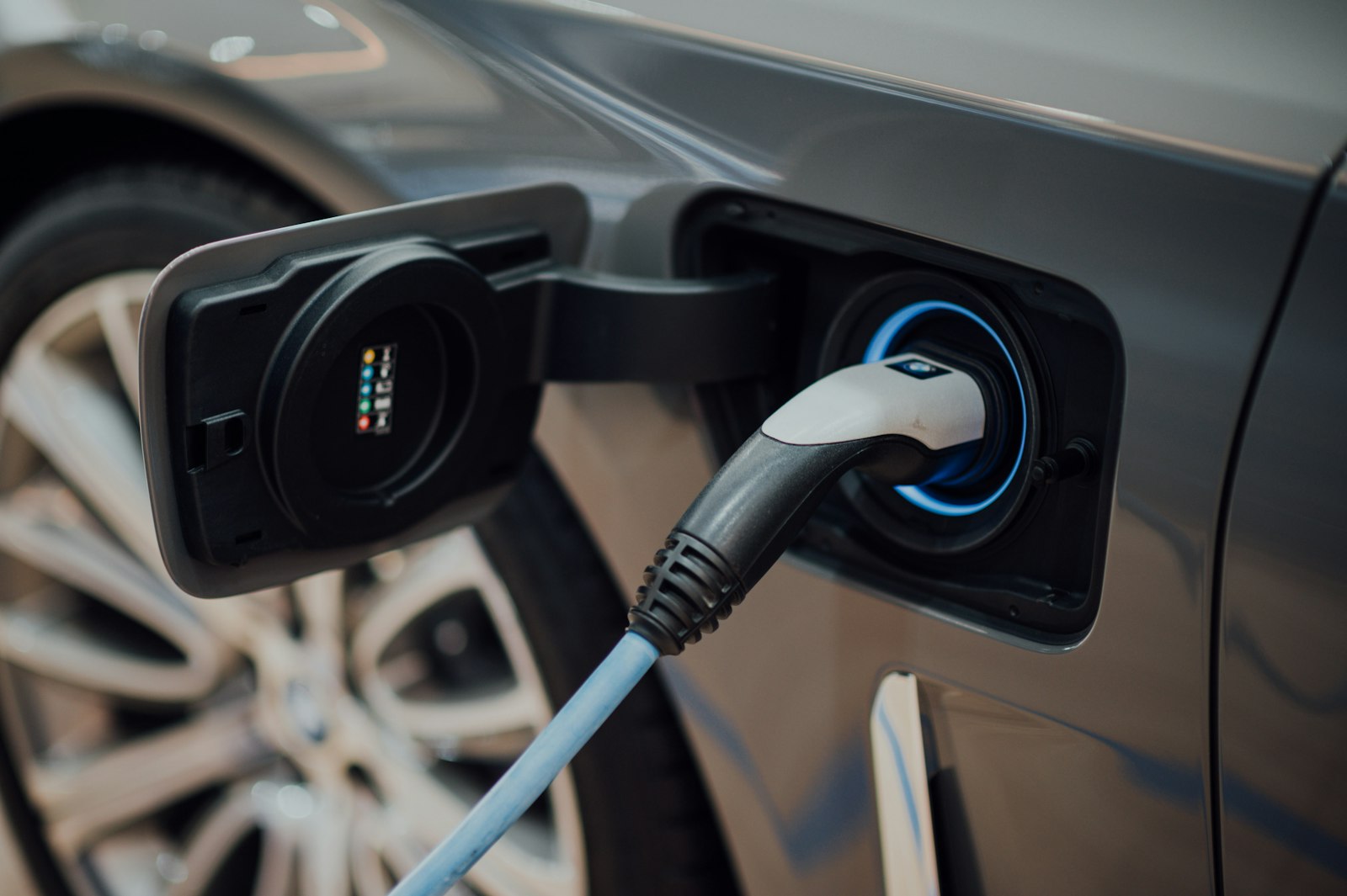 EV charging cable plugged into an electric vehicle